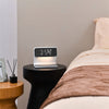 3-in-1 bedside lamp with wireless charging pad, adjustable light settings, and built-in clock