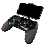 Person using a wireless controller to play a game on a mobile phone