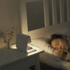 3-in-1 bedside lamp with wireless charging pad, adjustable light settings, and built-in clock