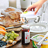 Automatic electric can opener with a sleek design, opening a can with a single button press