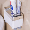 Touchless automatic toothpaste dispenser with a hand reaching towards the sensor to dispense toothpaste onto a toothbrush